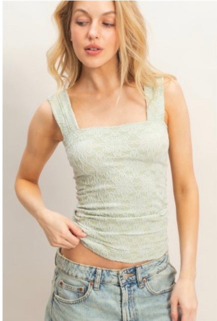 Sleeveless knit top with embroidered design